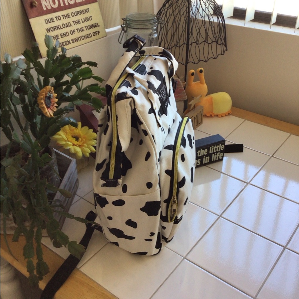 ‘Living Traveling Share’ Canvas Cow Print Backpack - Picture 3 of 8